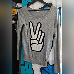 Large peace sign sweater
